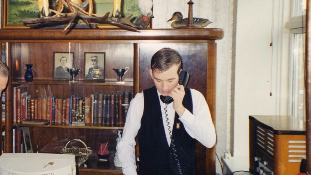 Waiter on the phone in old office