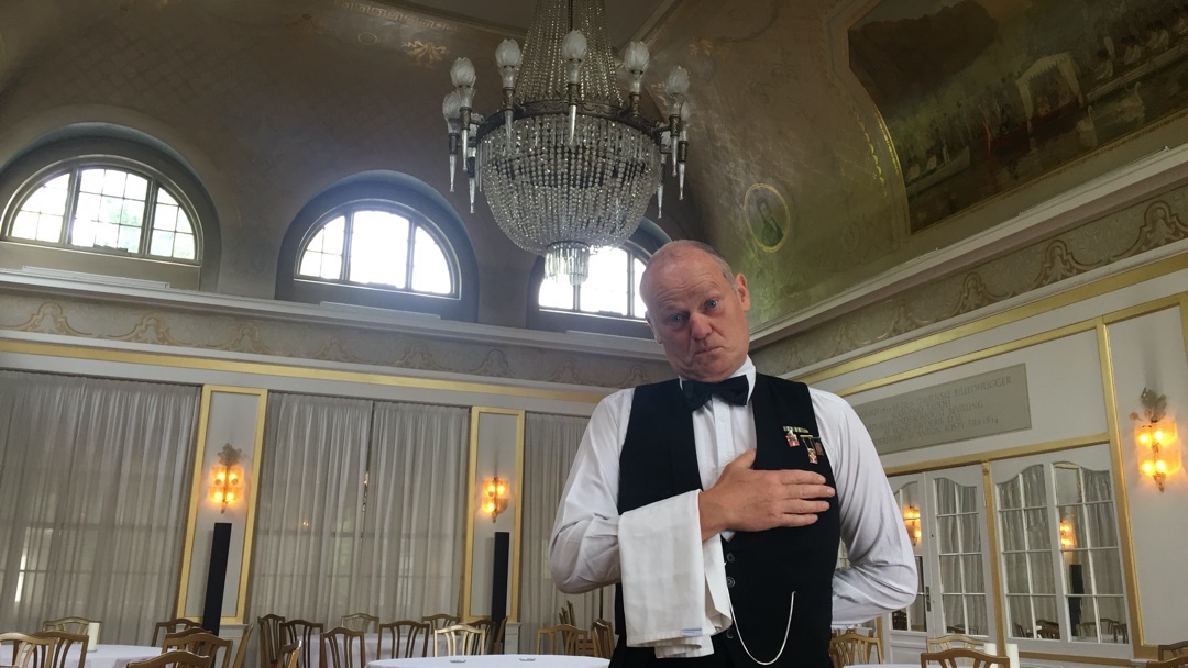 Waiter in empty restaurant